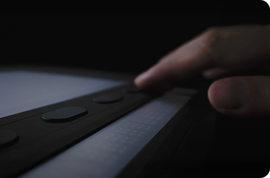 Exploring information through tactile interaction with a Dot device.